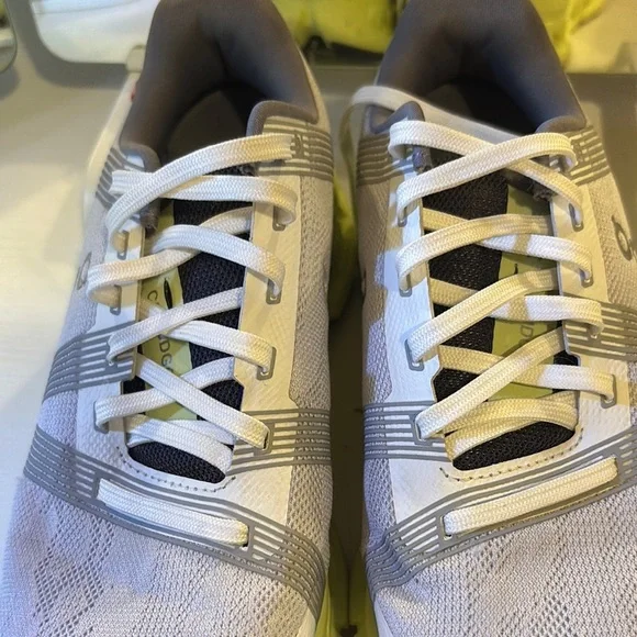 On Running Light Gray and Soft Yellow Shoes